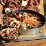 Manguinhos Gourmet terá aulas-show gratuitas de paella, vinho e risoto na Serra
